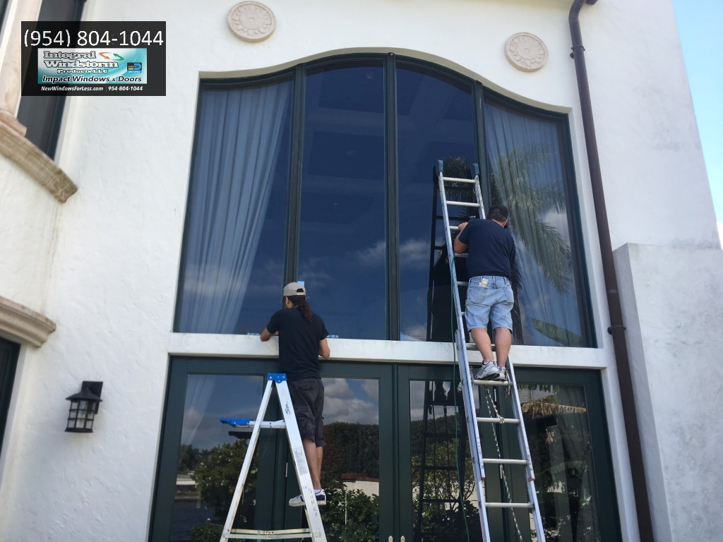 Window caulking company sealing caulking large picture windows and Door repairs and Impact glass replacement company
