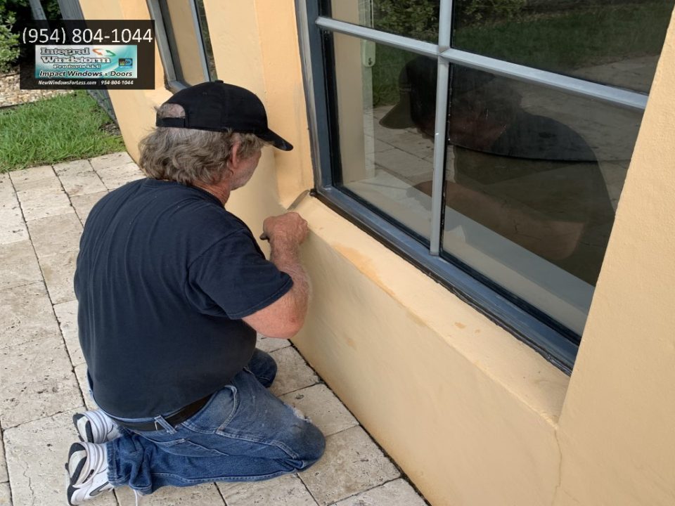 Window frame caulking and leak repair